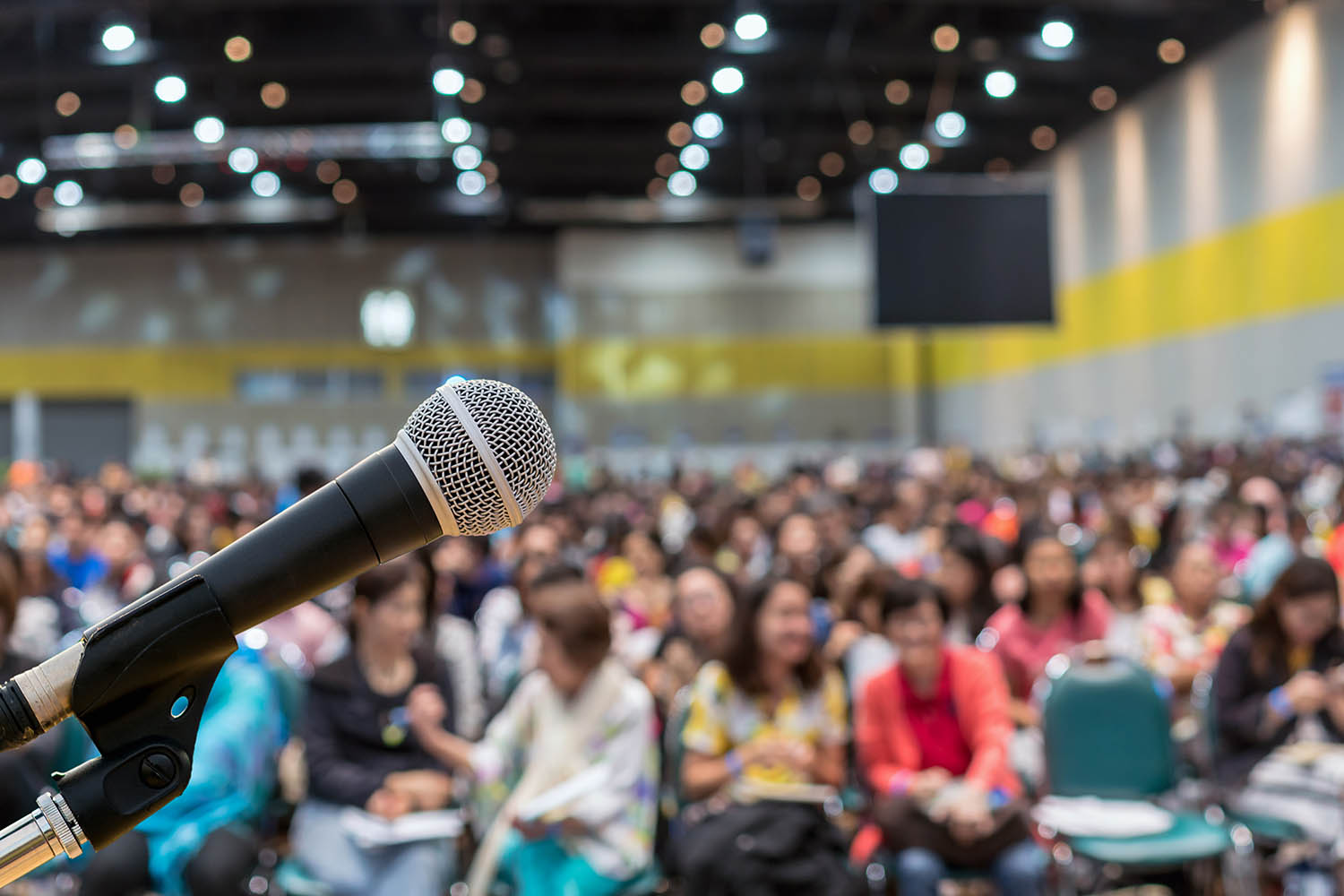 Blurred photo of microphone at school assembly